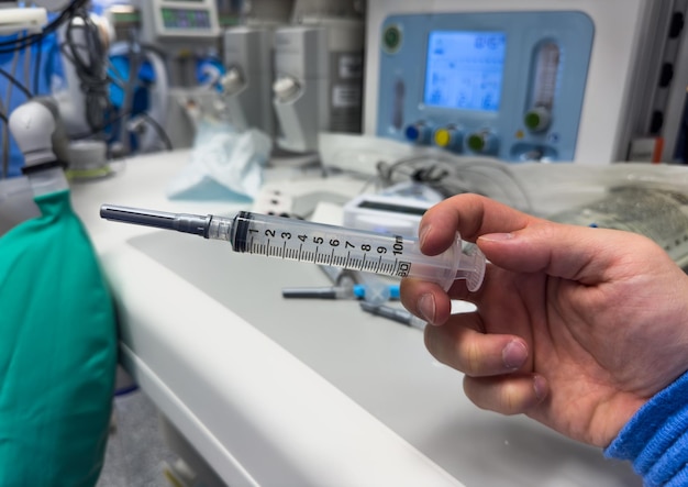 Clinical setting with medications syringes and needles on a hospital tray symbolizing healthcare